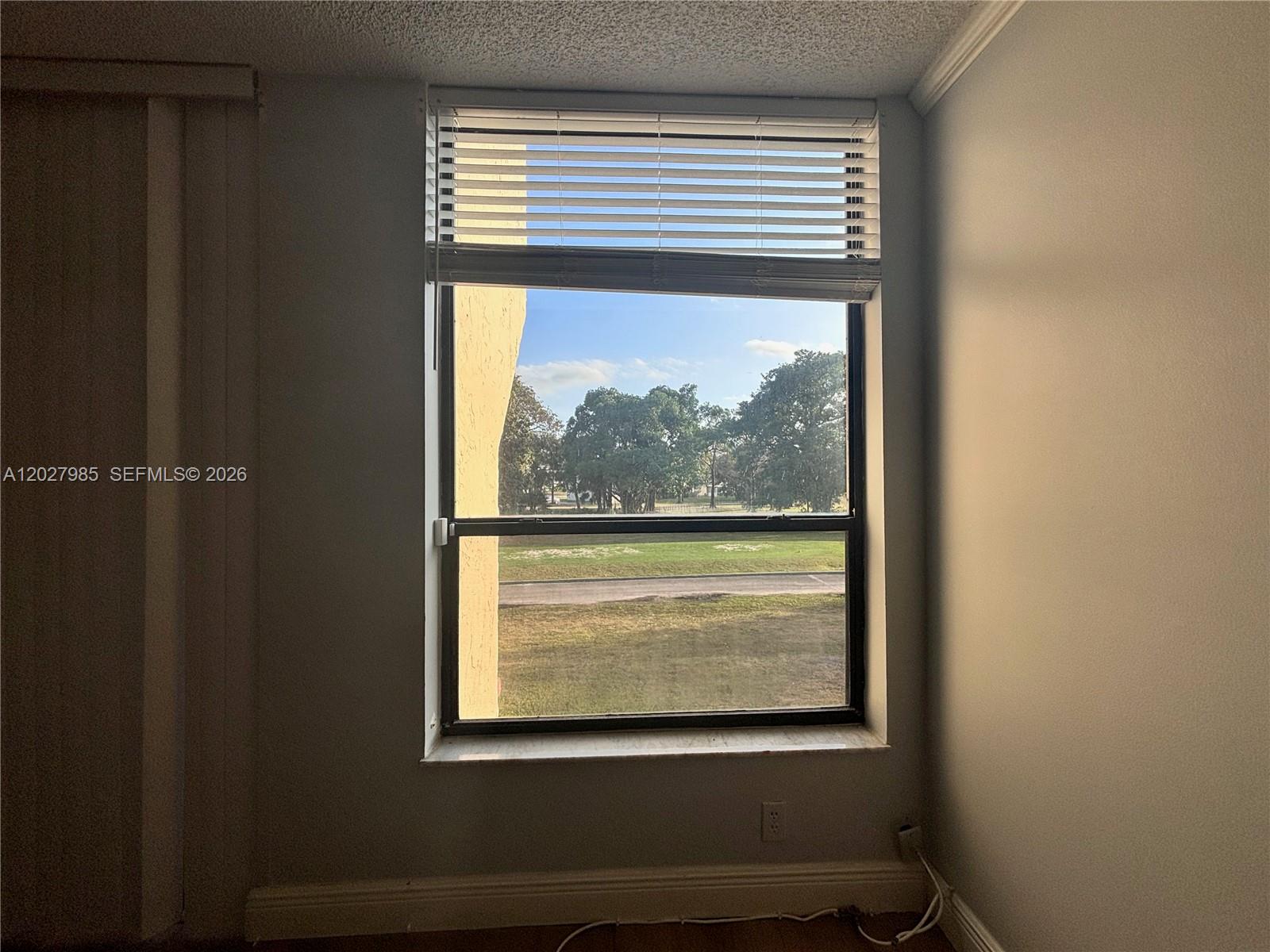 8050 West McNab Road, Unit 212 Tamarac, FL 33321 - Photo 3 of 19 View of golf course from living room.