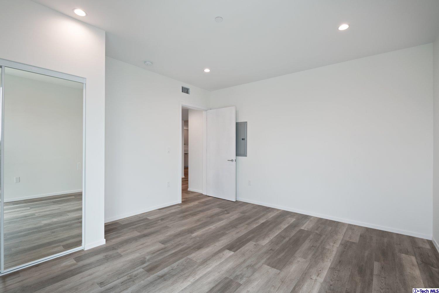 7064 Greeley Street, Unit 201 Tujunga, CA 91042 - Photo 23 of 34 a view of hallway with wooden floor