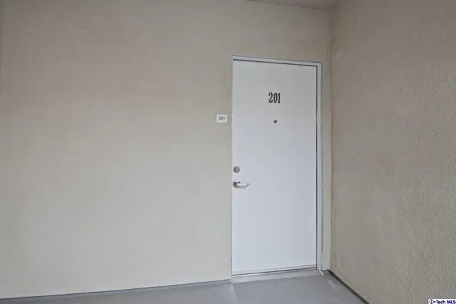 a view of kitchen with kitchen island microwave and stove