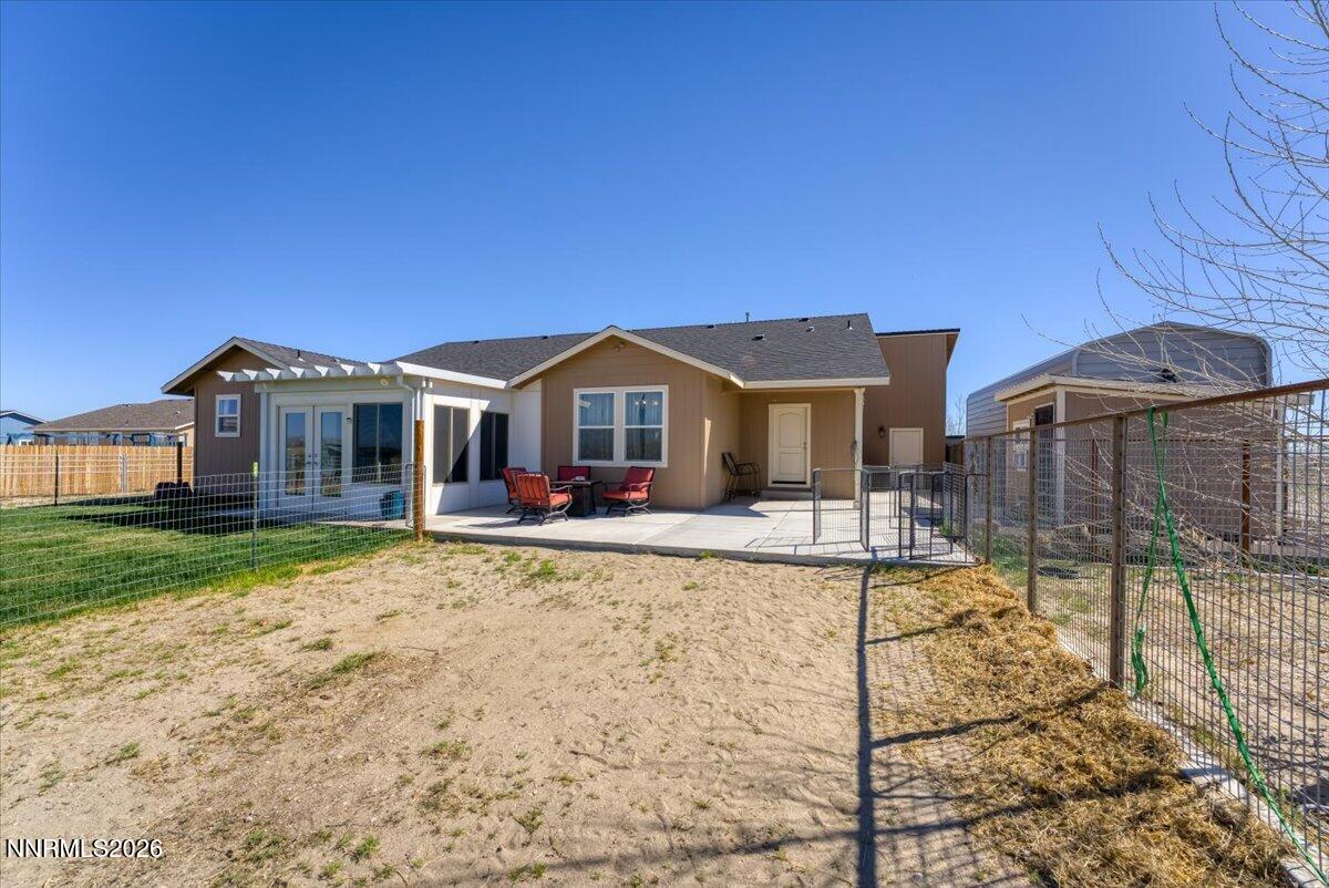 1197 Sky Ridge Drive Fallon, NV 89406 - Photo 35 of 79 a view of a house with backyard and sitting area