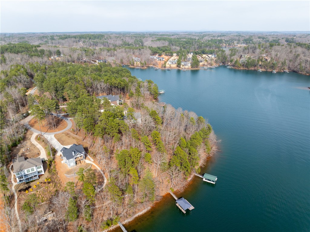 537 Peninsula Road West Union, SC 29696 - Photo 5 of 15 This aerial view showcases homes nestled by a serene lake, featuring private docks and lush surroundings.