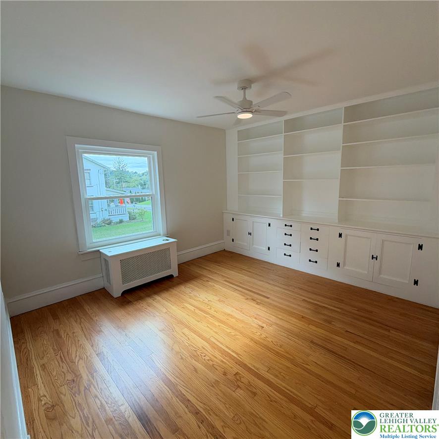 5111 Vera Cruz Road Emmaus, PA 18049 - Photo 15 of 44 Hardwood floors and built-in shelving define this versatile room.