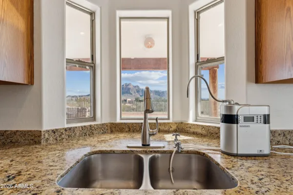 a view of bathroom with a glass door shower and a sink