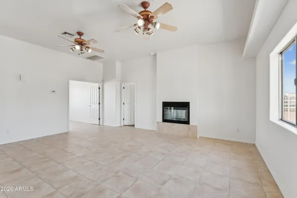 a view of an empty room with a window