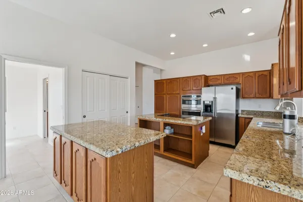 a kitchen with a sink a counter top space and a window