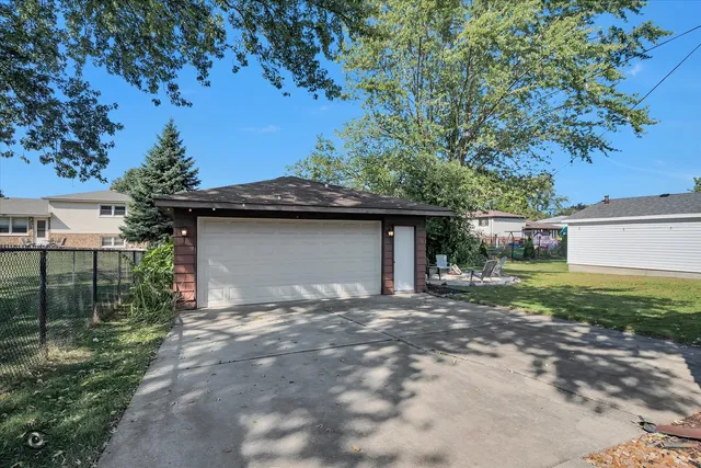 a house that has a tree in front of the house