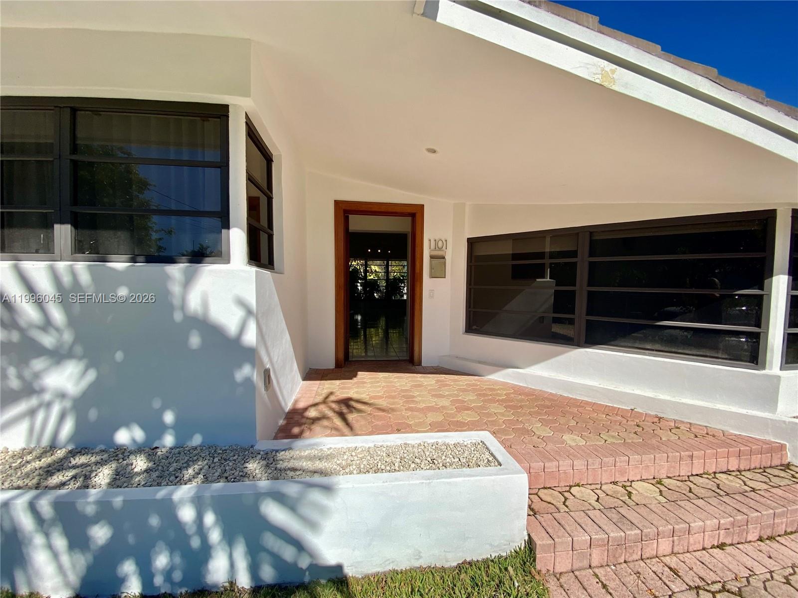1101 Bay Drive Miami Beach, FL 33141 - Photo 22 of 69 a view of a entryway door of the house