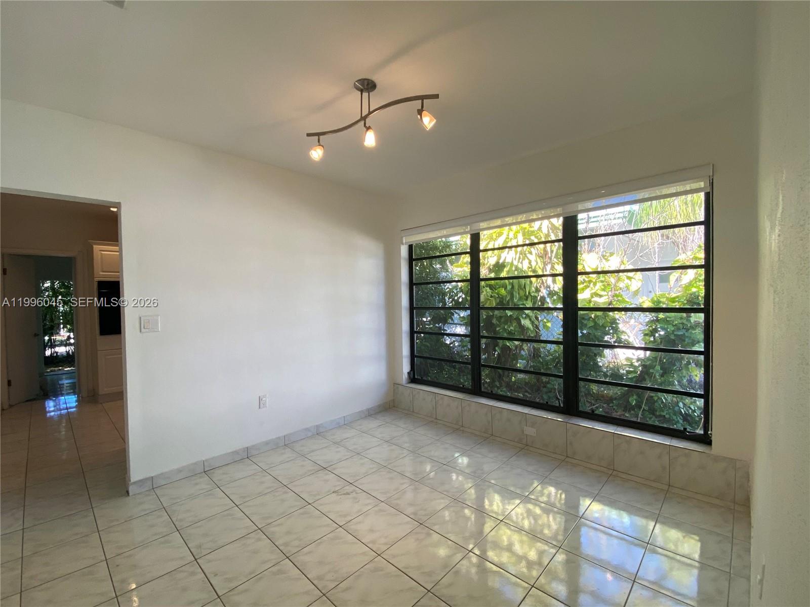 1101 Bay Drive Miami Beach, FL 33141 - Photo 30 of 69 a view of an empty room with windows