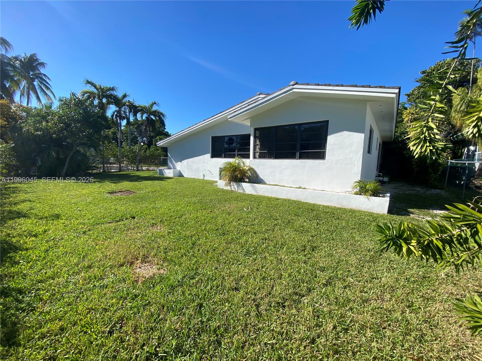 1101 Bay Drive Miami Beach, FL 33141 - Photo 3 of 69 a view of a house with a yard