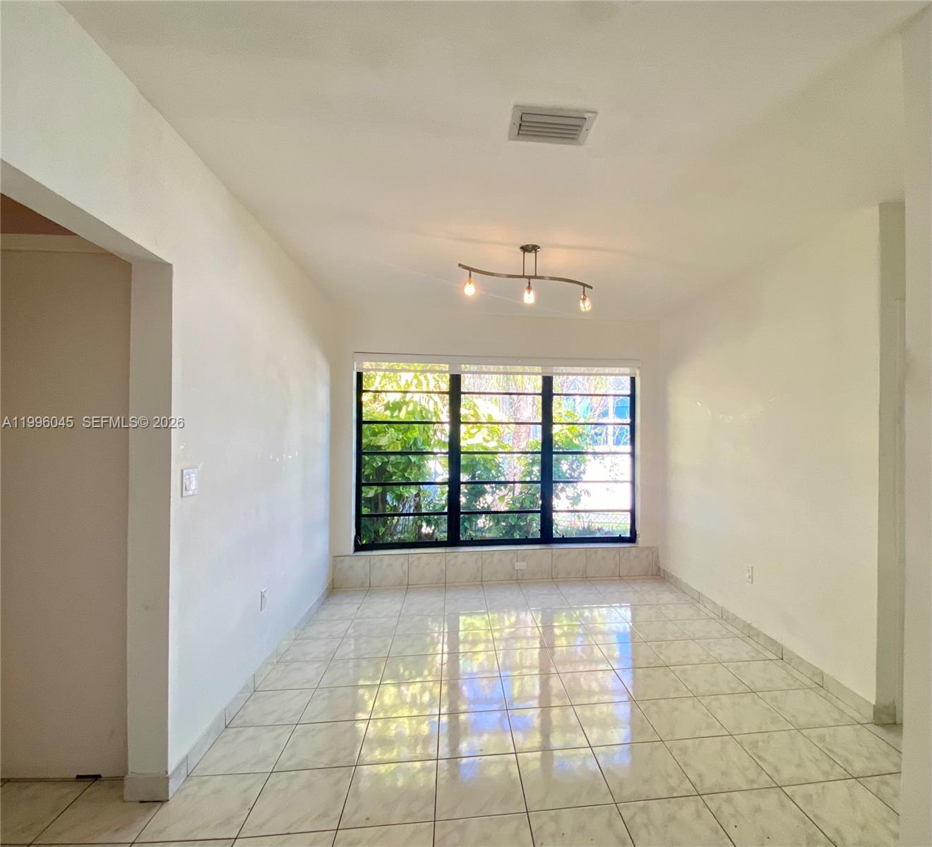 1101 Bay Drive Miami Beach, FL 33141 - Photo 34 of 69 a view of an empty room with a window
