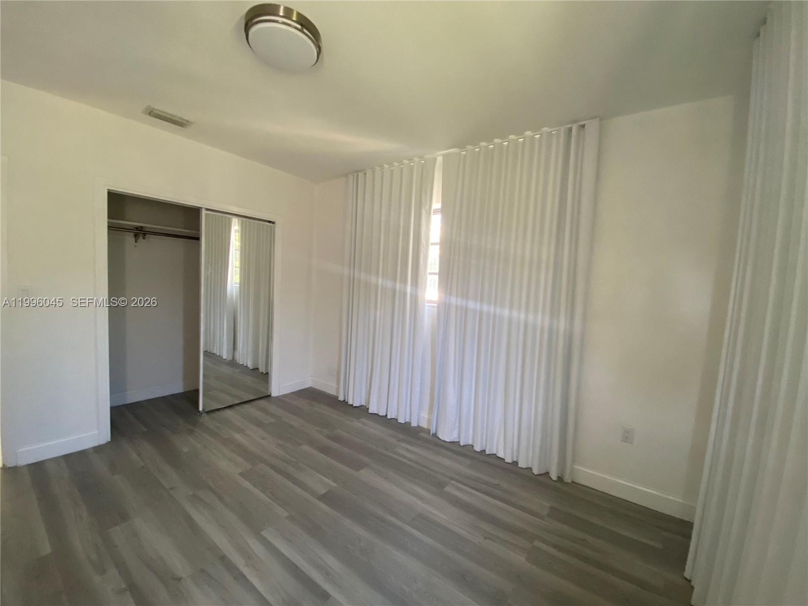 1101 Bay Drive Miami Beach, FL 33141 - Photo 44 of 69 a view of a livingroom with wooden floor