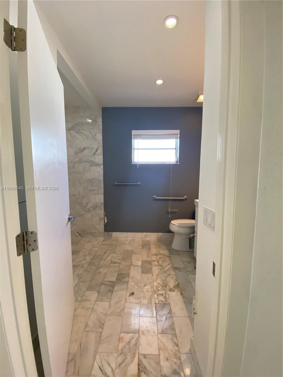 1101 Bay Drive Miami Beach, FL 33141 - Photo 48 of 69 a bathroom with a sink and a toilet