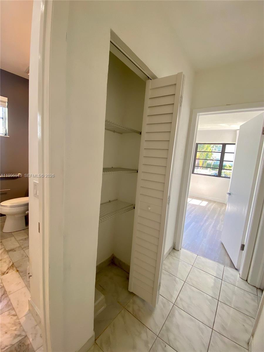 1101 Bay Drive Miami Beach, FL 33141 - Photo 52 of 69 a view of an empty room and wooden floor
