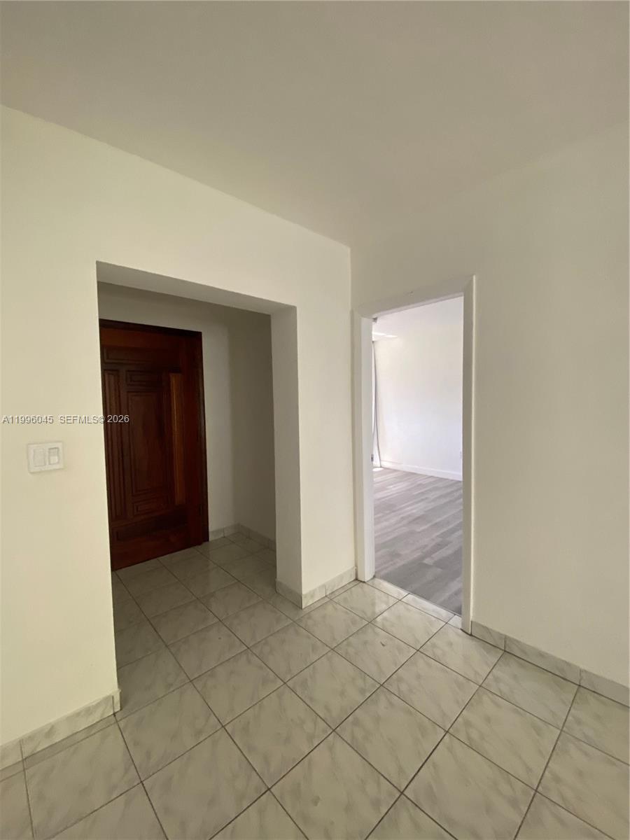 1101 Bay Drive Miami Beach, FL 33141 - Photo 54 of 69 an empty room that has a wooden cupboard