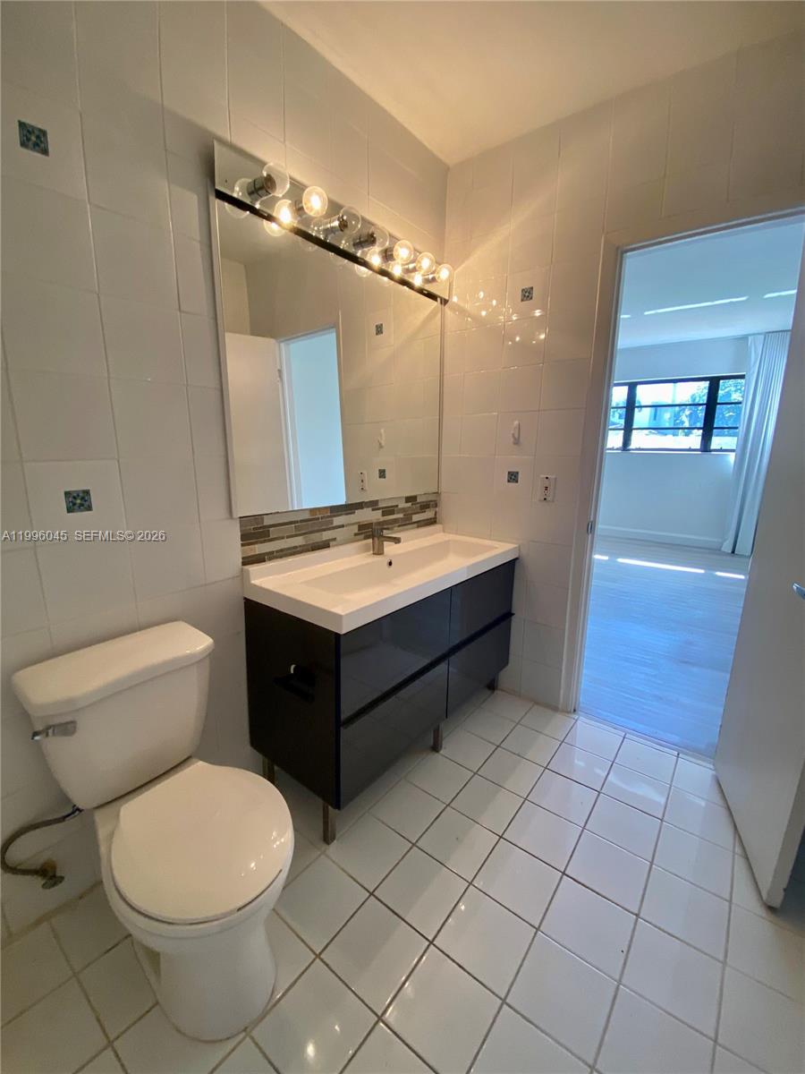 1101 Bay Drive Miami Beach, FL 33141 - Photo 64 of 69 a bathroom with a sink toilet and shower