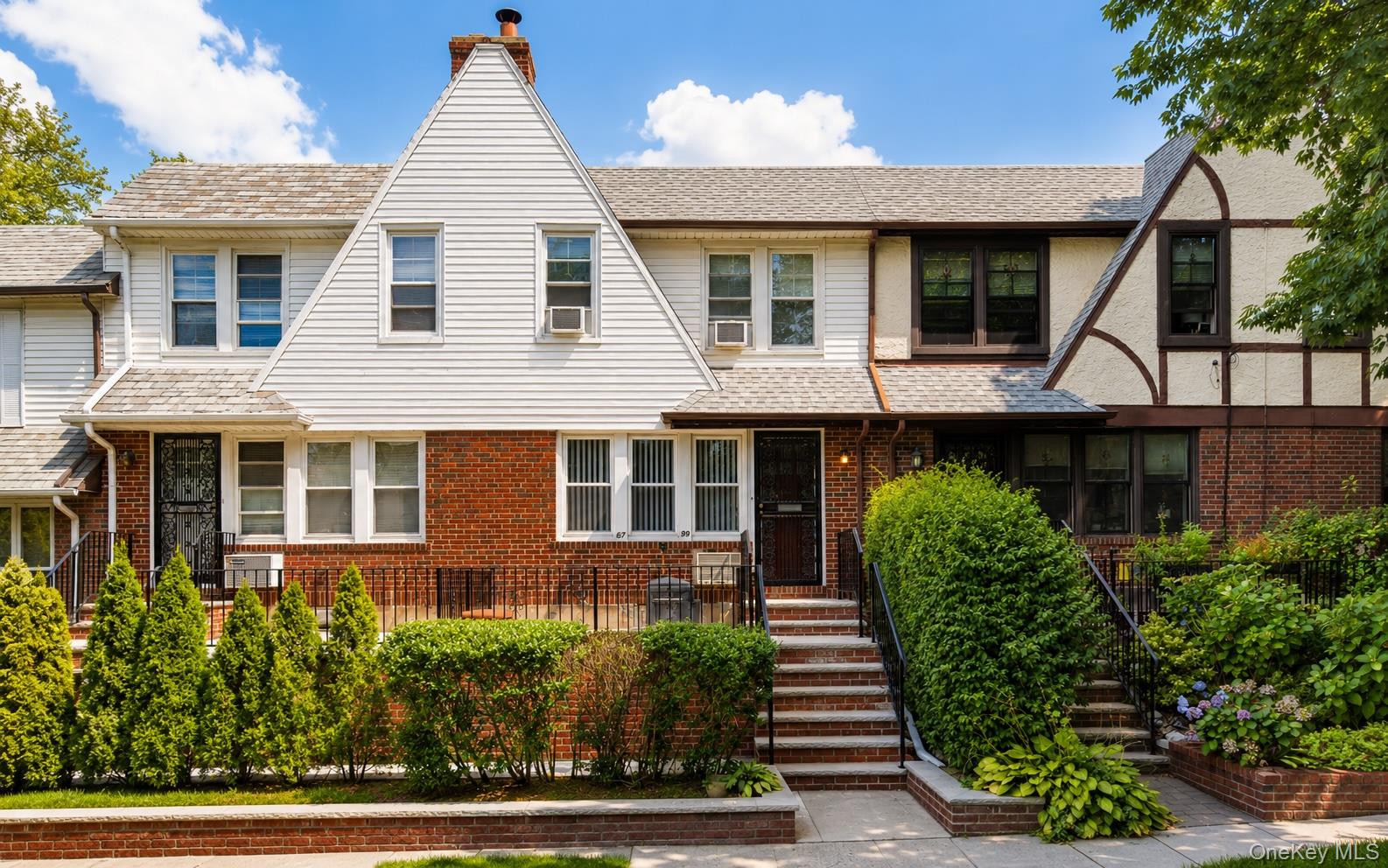 67-99 Exeter Street Queens, NY 11375 - Photo 1 of 28 a front view of a house with a garden