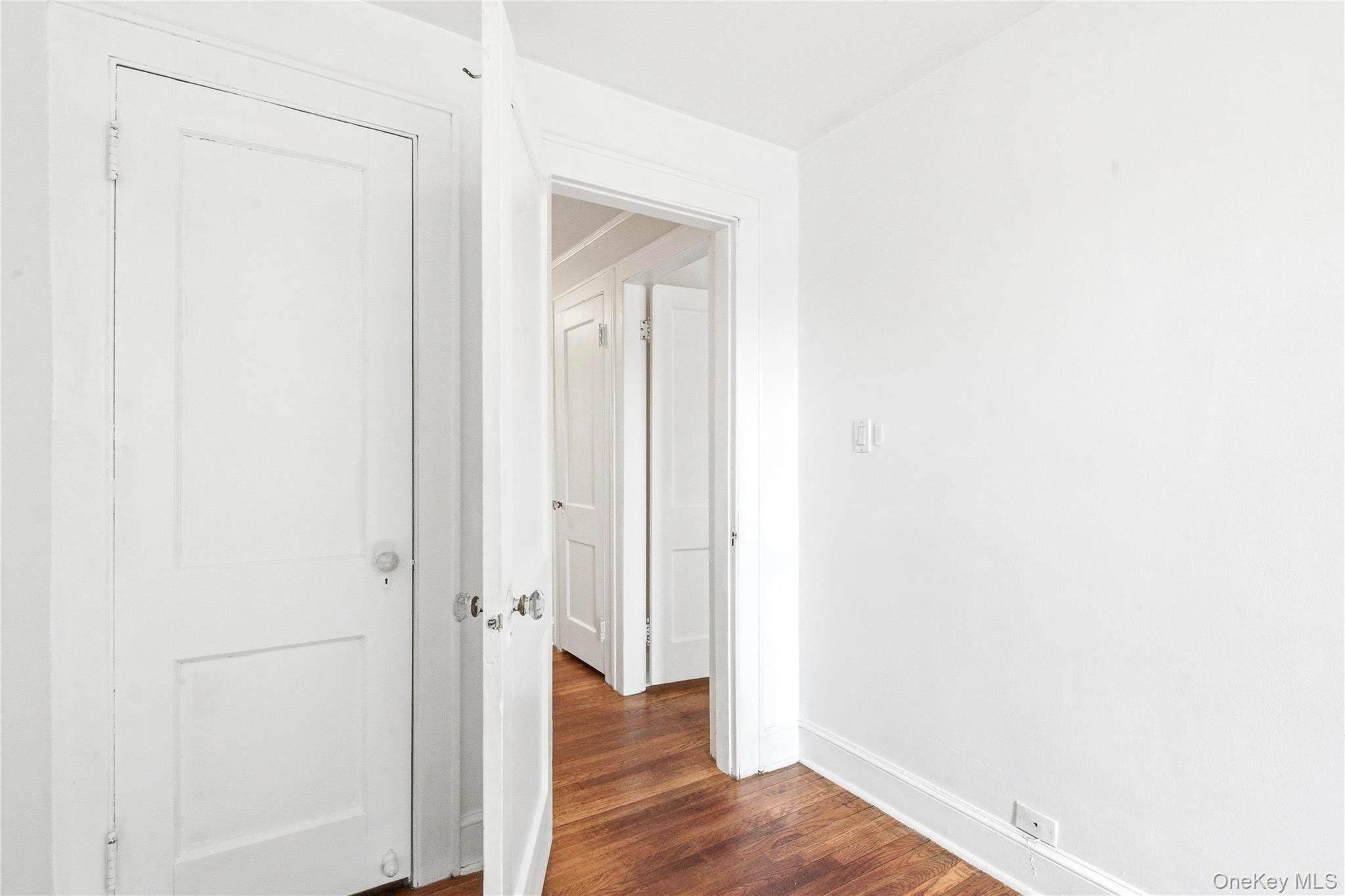67-99 Exeter Street Queens, NY 11375 - Photo 20 of 28 a view of a hallway with wooden floor