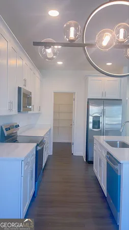a kitchen with a sink and cabinets