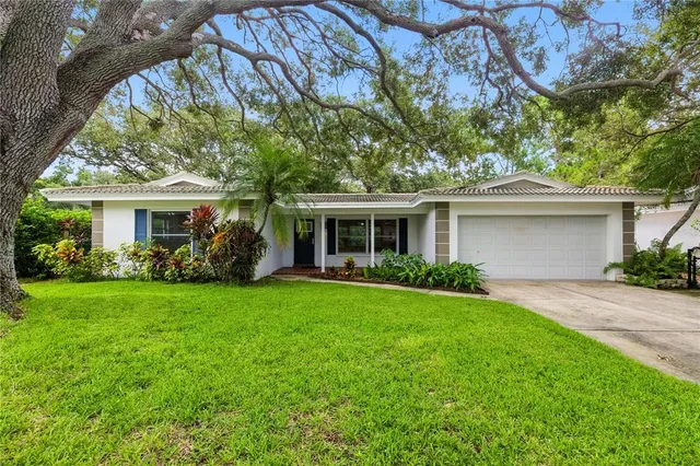 front view of a house with a garden