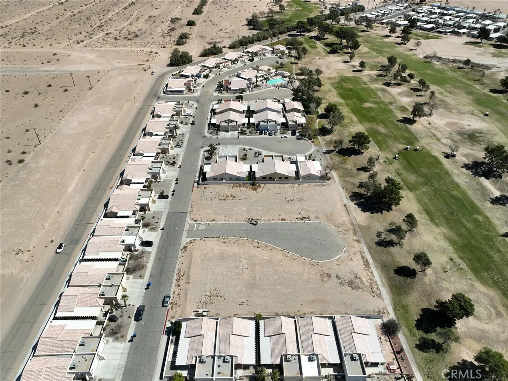 38 Par Blythe, CA 92225 - Photo 4 of 10 an aerial view of multi story residential apartment building with yard