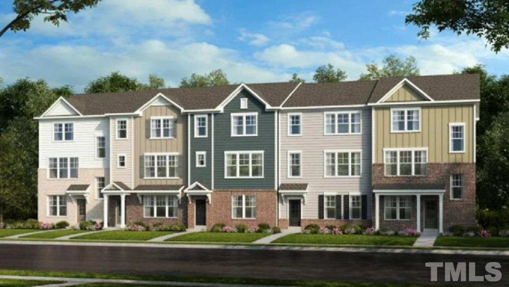 3255 Lynn Road, Unit 15 Raleigh, NC 27613 - Photo 1 of 21 a front view of a building with a garden and plants