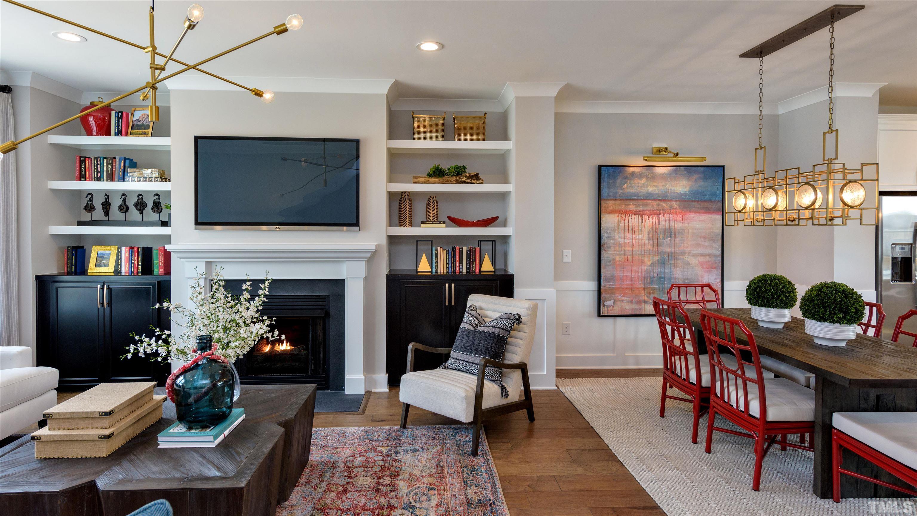 3255 Lynn Road, Unit 15 Raleigh, NC 27613 - Photo 11 of 21 a living room with furniture fireplace and flat screen tv