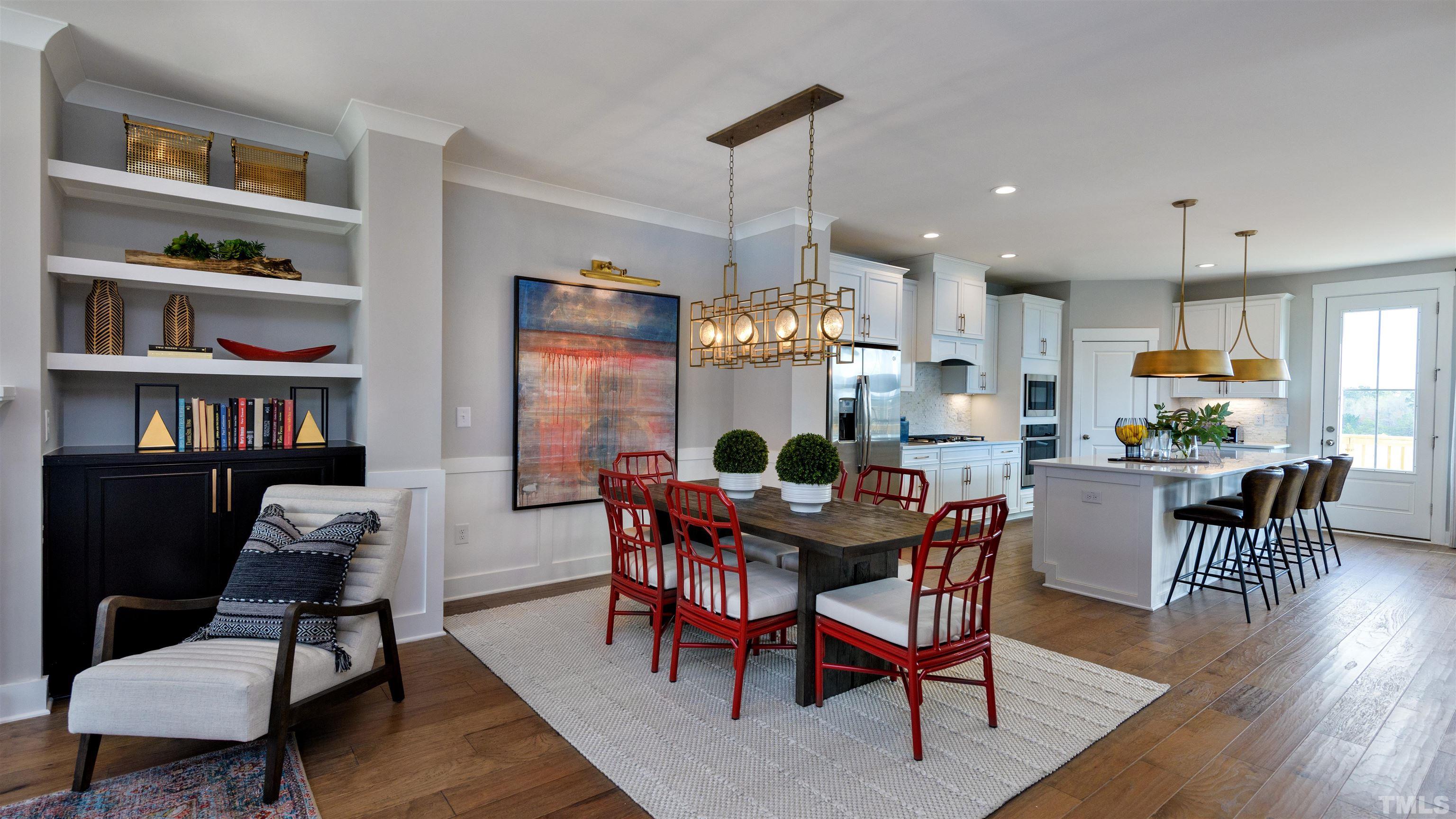 3255 Lynn Road, Unit 15 Raleigh, NC 27613 - Photo 12 of 21 a dining room with furniture and a book shelf