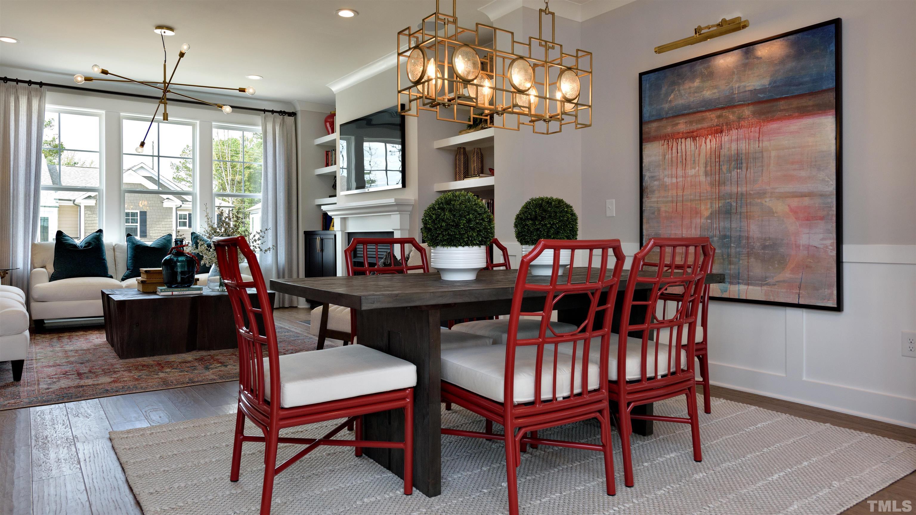 3255 Lynn Road, Unit 15 Raleigh, NC 27613 - Photo 14 of 21 a view of a dining room with furniture a chandelier and wooden floor