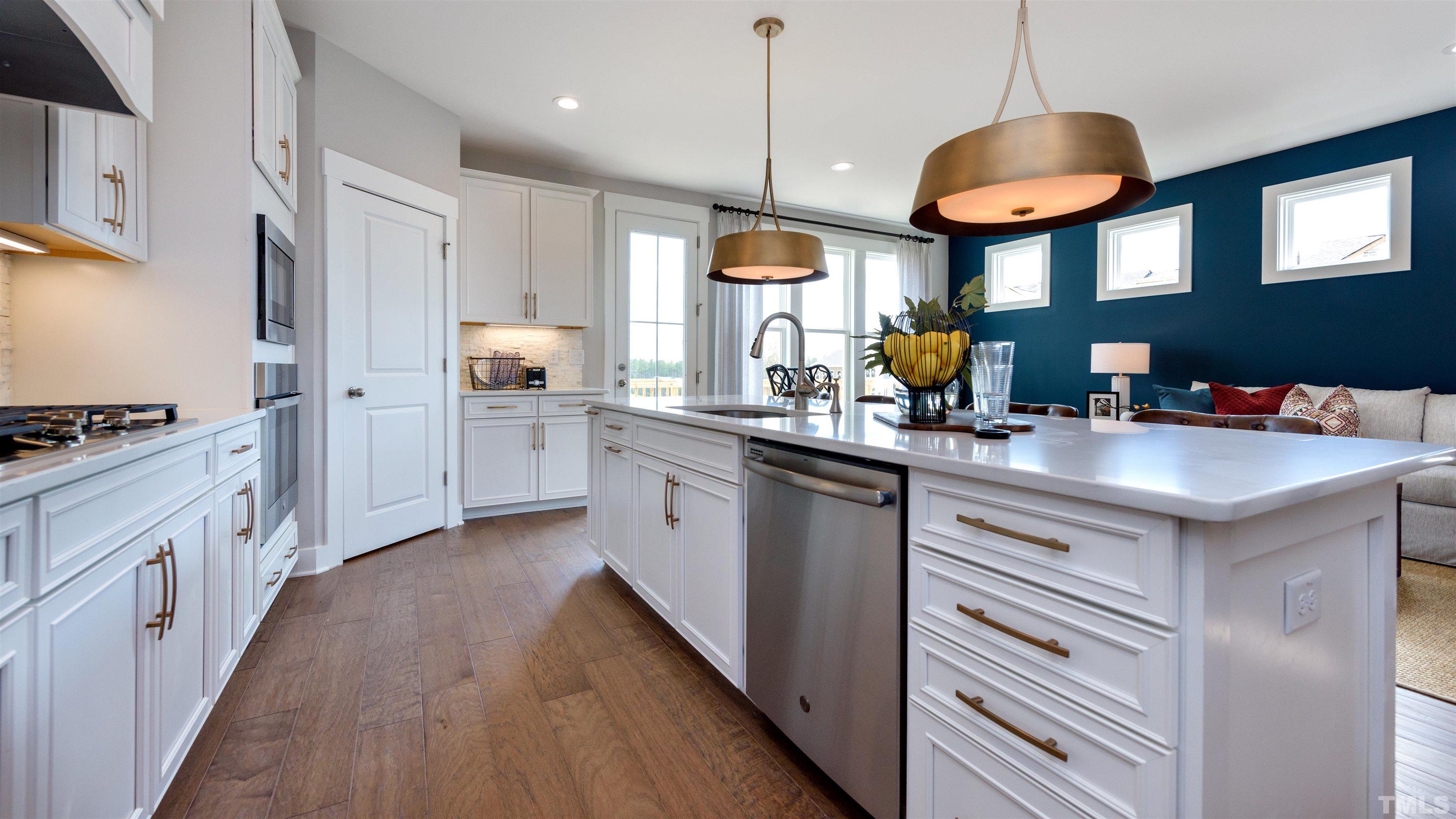 3255 Lynn Road, Unit 15 Raleigh, NC 27613 - Photo 15 of 21 a kitchen with stainless steel appliances a stove sink and cabinets
