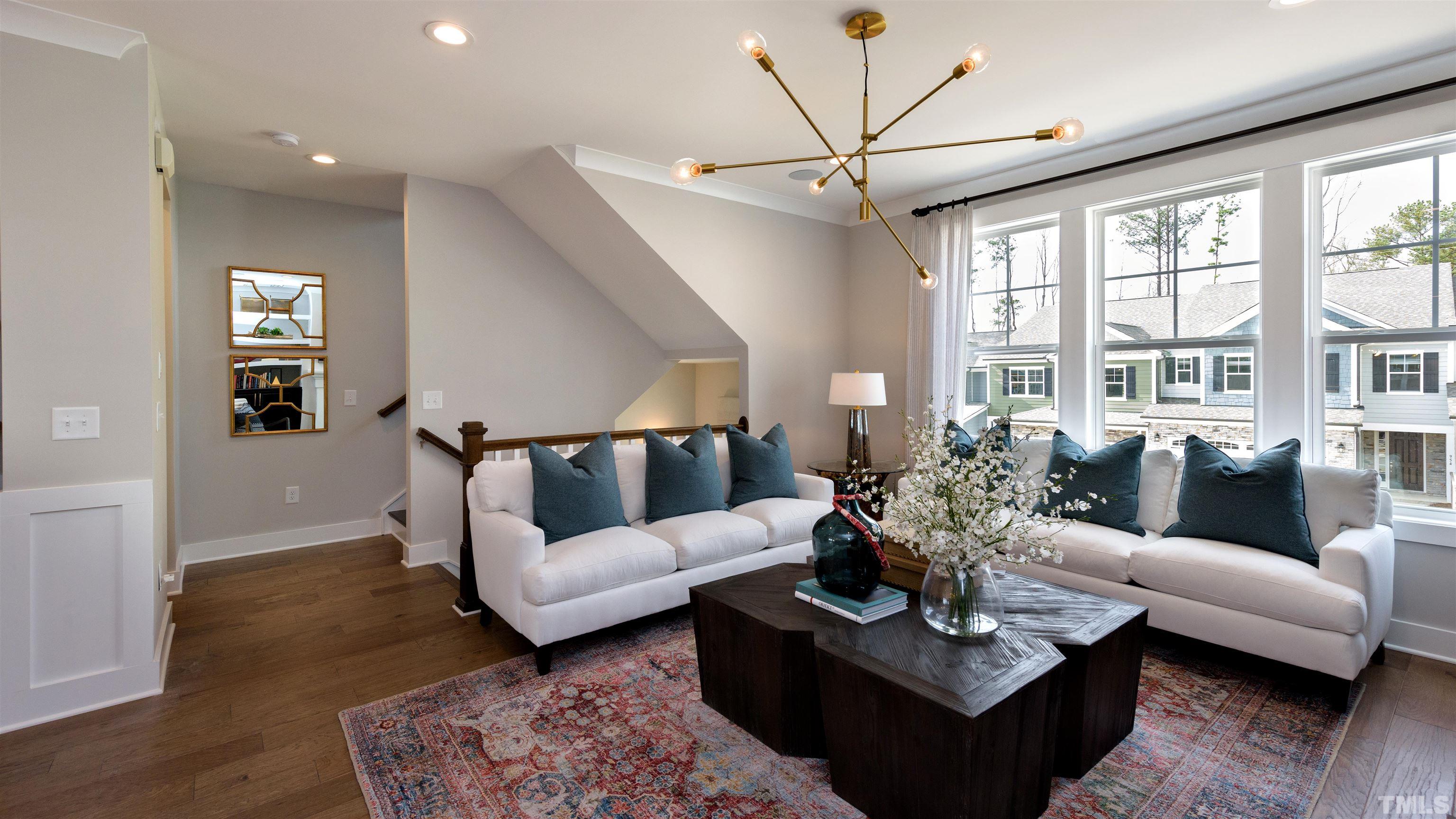3255 Lynn Road, Unit 15 Raleigh, NC 27613 - Photo 17 of 21 a living room with furniture potted plant and a window
