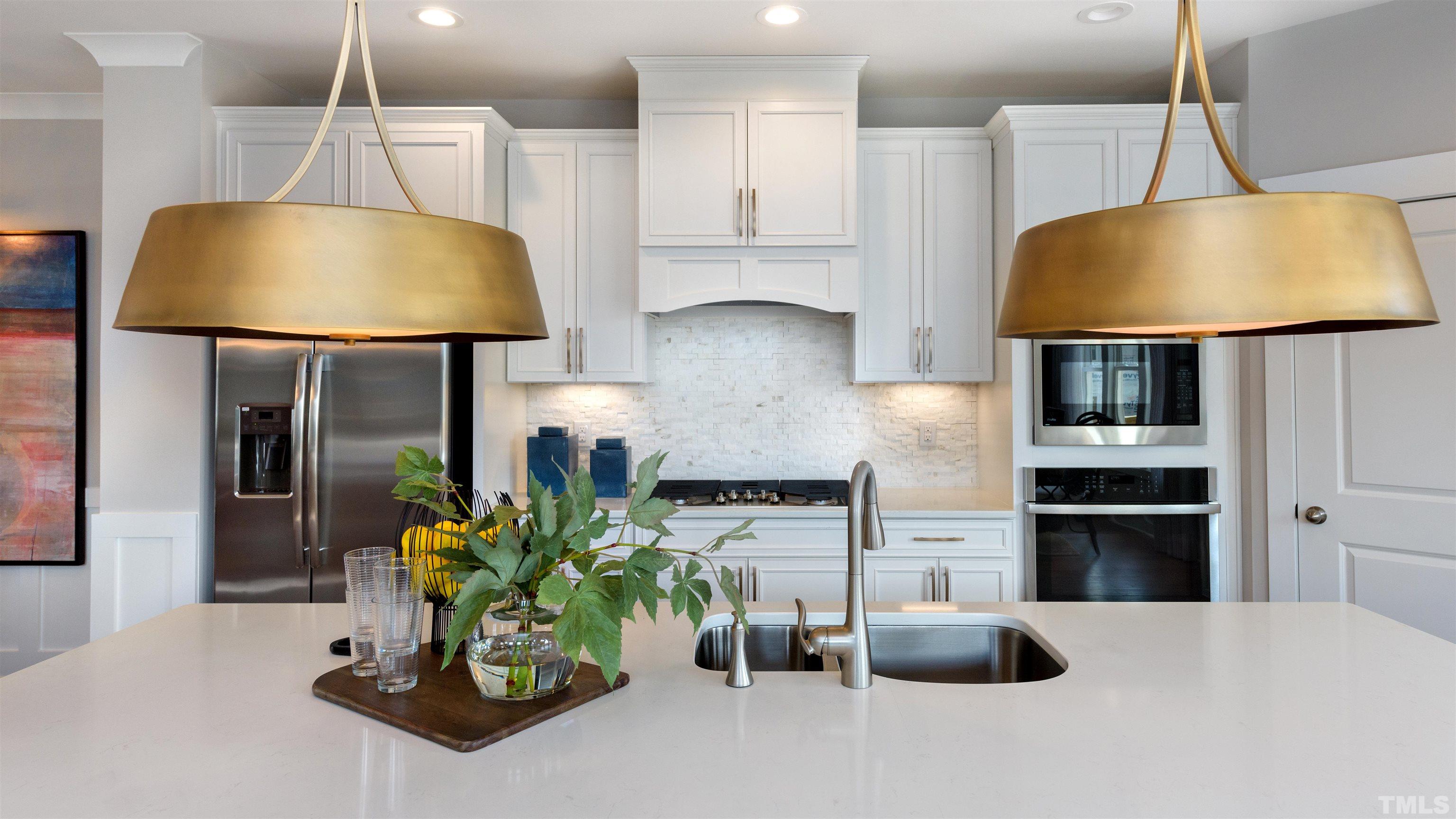 3255 Lynn Road, Unit 15 Raleigh, NC 27613 - Photo 19 of 21 a kitchen with stainless steel appliances granite countertop a sink a stove and a wooden floors