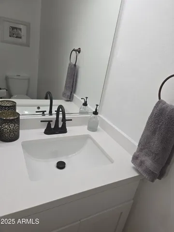 a living room with furniture and a book shelf