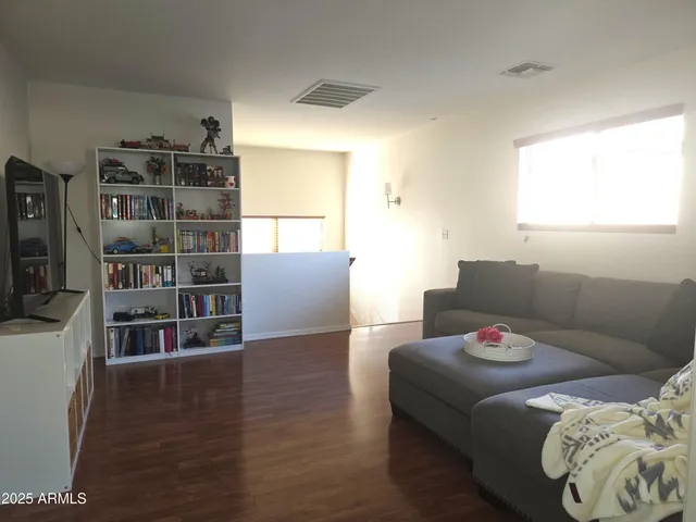 a bed room with a bed and a television