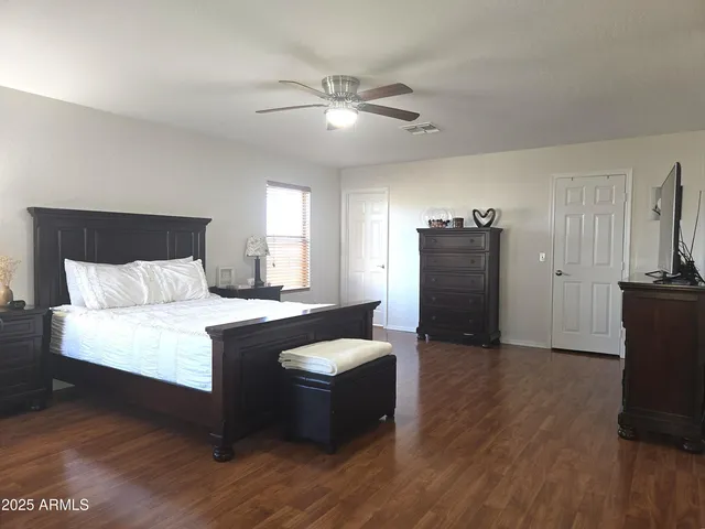 a view of a livingroom with furniture wooden floor and a window