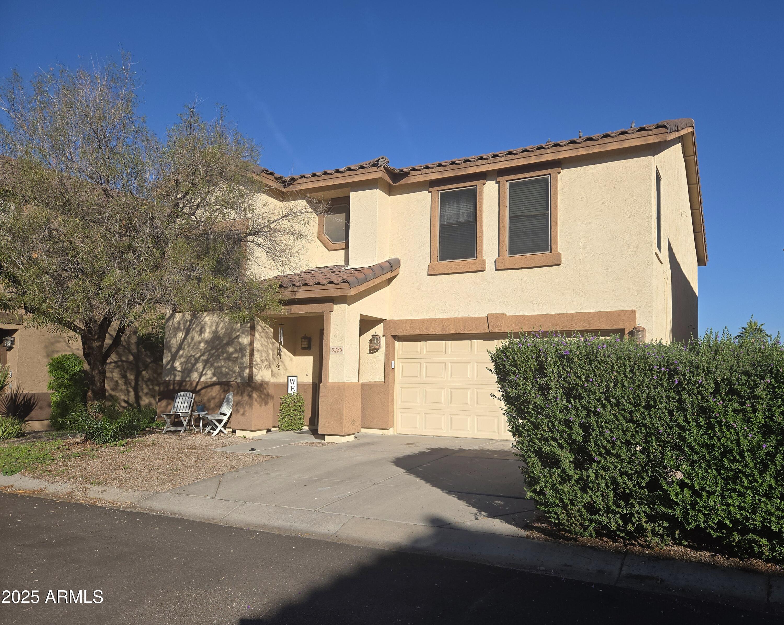 3283 South Conestoga Road Apache Junction, AZ 85119 - Photo 2 of 32 a front view of a house with a yard
