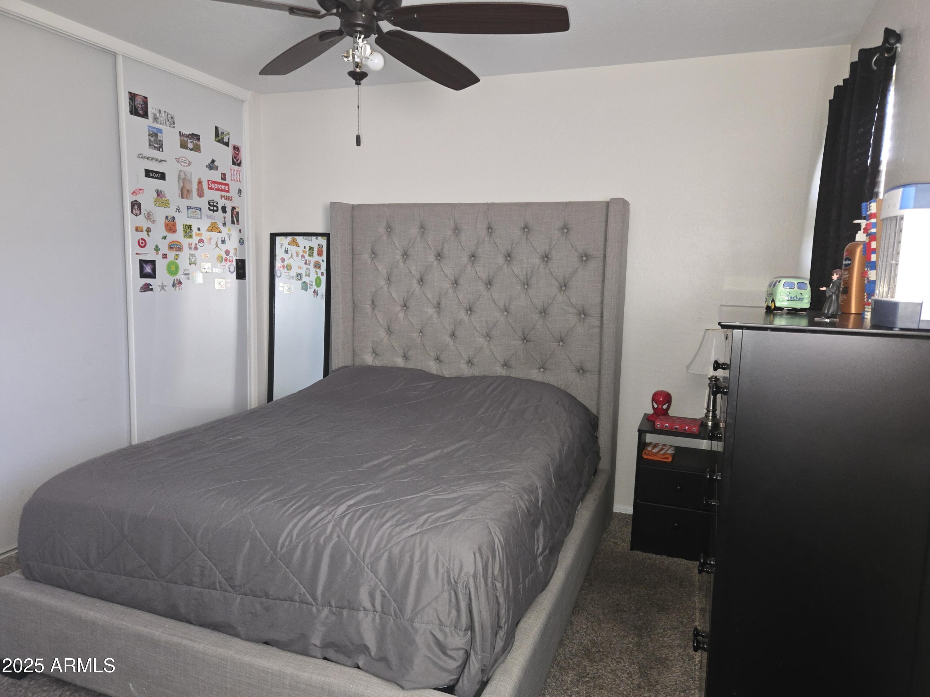 3283 South Conestoga Road Apache Junction, AZ 85119 - Photo 24 of 32 a bedroom with a bed and a flat screen tv