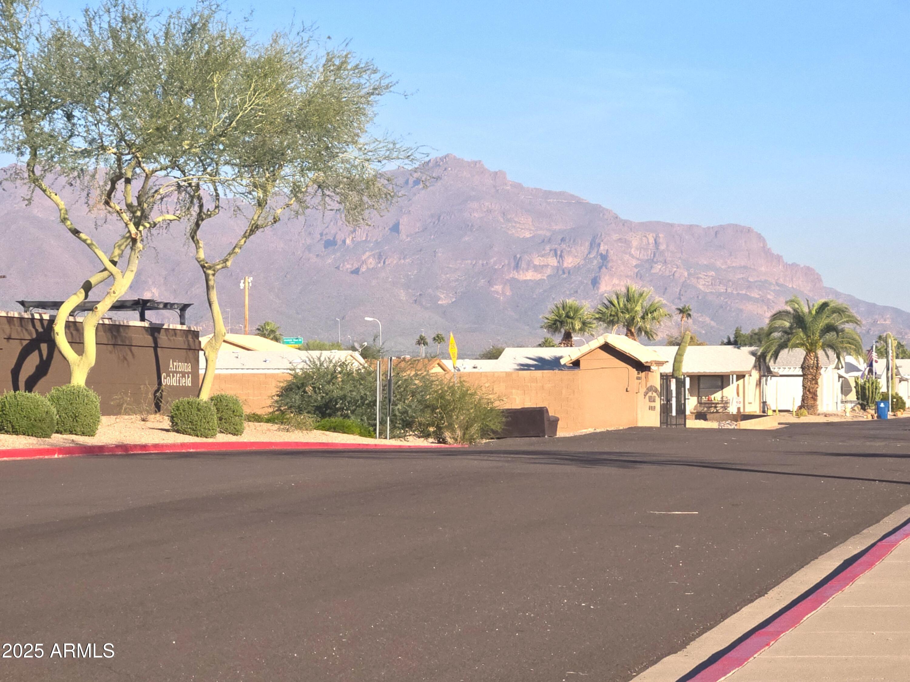 3283 South Conestoga Road Apache Junction, AZ 85119 - Photo 31 of 32 a view of a street with a house in the background