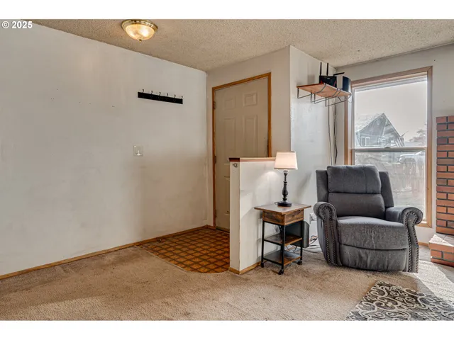a kitchen with stainless steel appliances granite countertop a sink a stove a counter space and cabinets