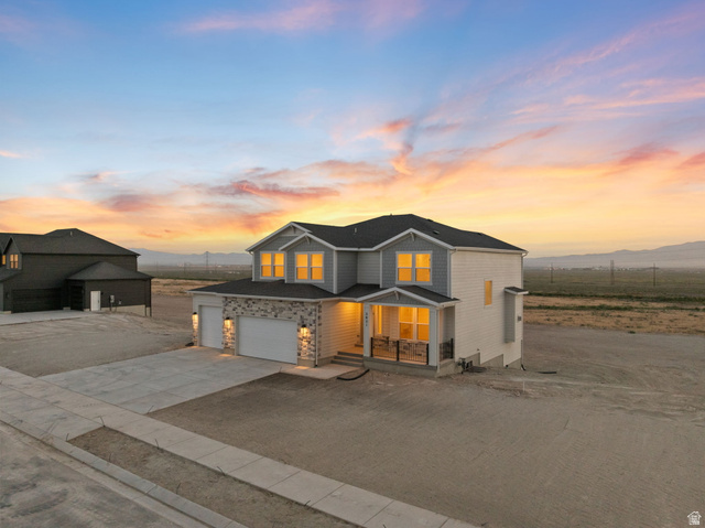 2821 Scarlet Road, Unit 149 Eagle Mountain, UT 84005 - Photo 4 of 28 Our two-story "Magnolia" with large covered porch and beautiful mountain views, picture taken near northeast corner of the property, a .75 acre lot.