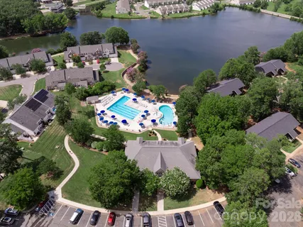 an aerial view of a house with a yard and garden