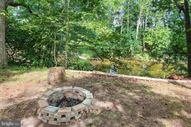 a view of a hallway with furniture and entryway