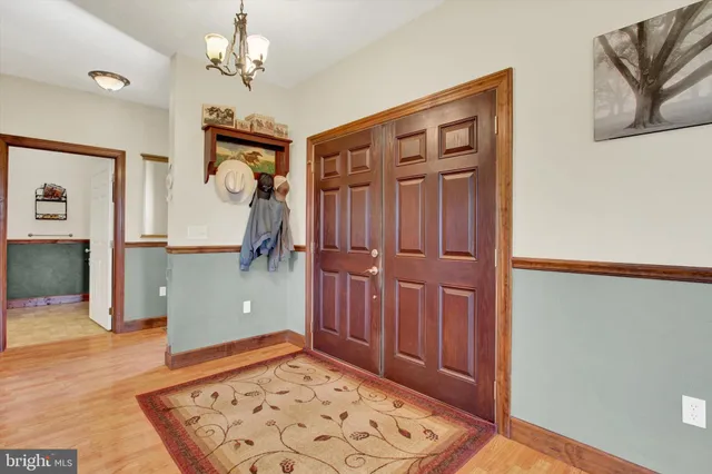 a living room with furniture and a ceiling fan