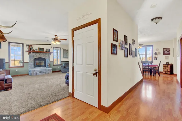 a living room with furniture and large windows