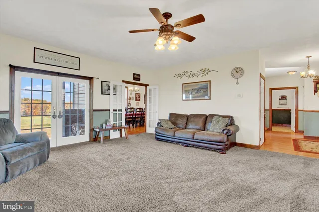 a kitchen with granite countertop a refrigerator and a sink