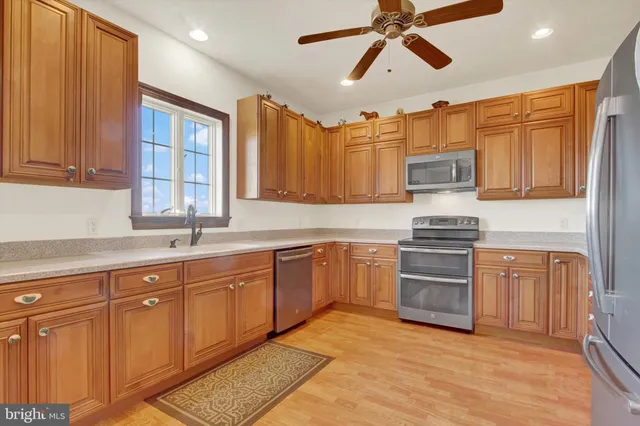 a view of a livingroom with furniture and stairs