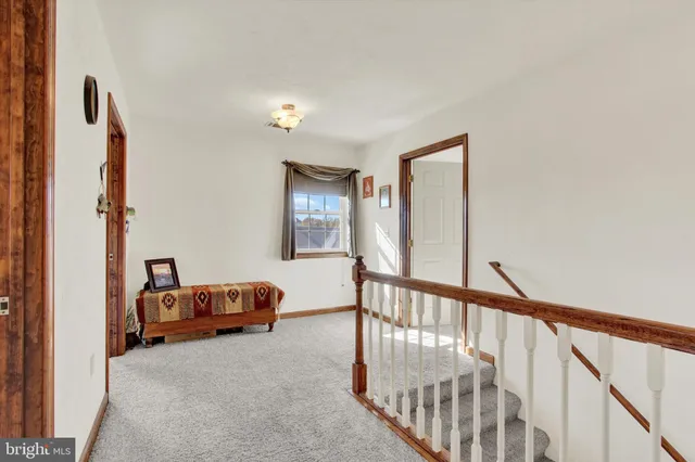 a room with furniture and pool table