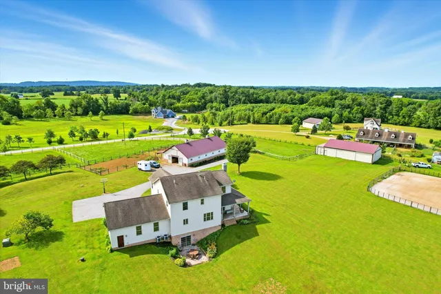 a view of a house with a yard and garage