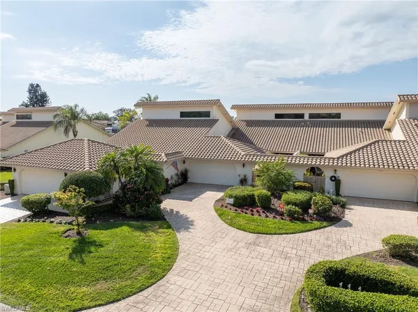 a swimming pool with outdoor seating and entertaining space