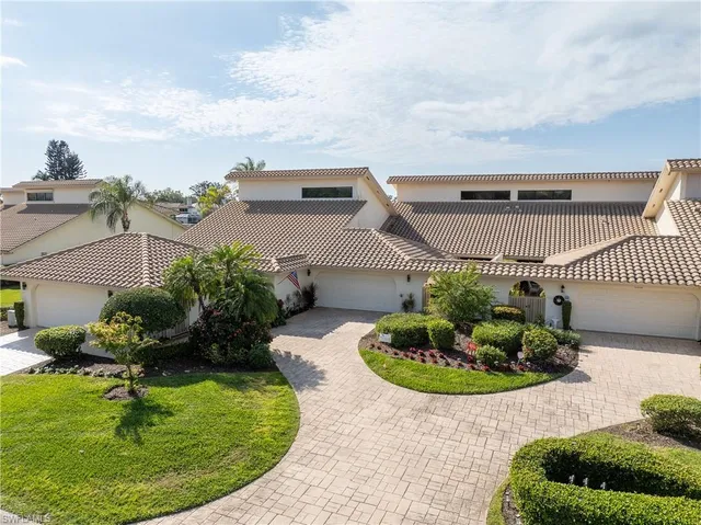 a swimming pool with outdoor seating and entertaining space