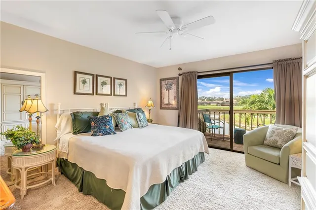 a bedroom with a large bed and a large window